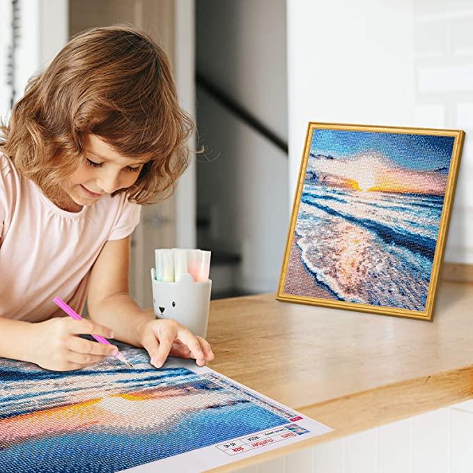 Diamond painting is a relatively simple craft activity that involves placing tiny resin "diamonds" or rhinestones onto a pre-printed canvas to create a sparkling mosaic image.